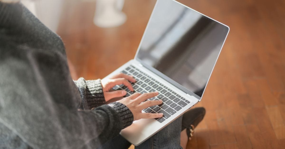 person typing on computer during COVID-19 pandemic