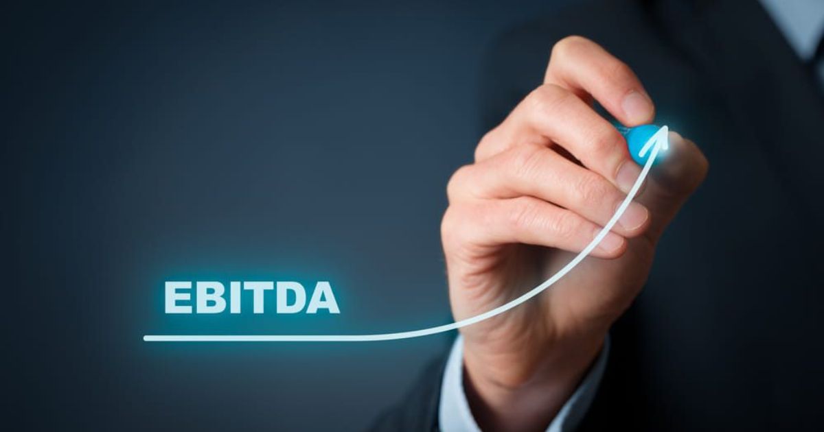 Businessman draw graph with growing EBITDA