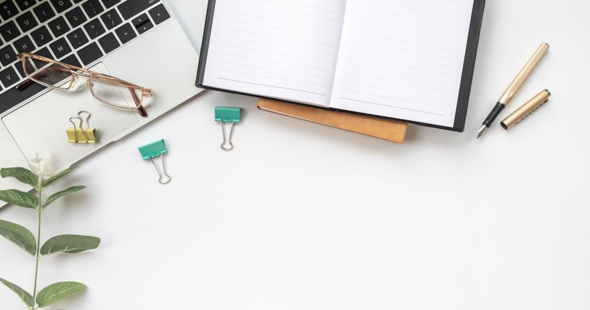 annual review, a financial spring cleaning for your business photo of a laptop and green leafe