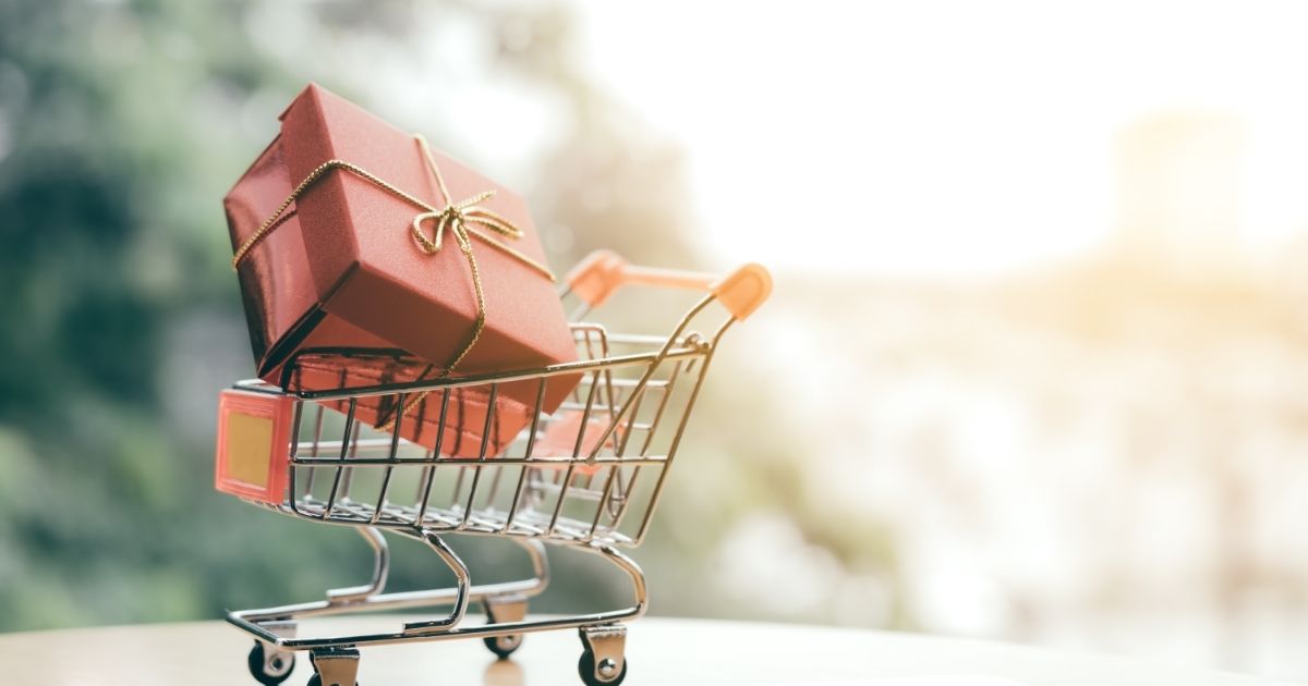 photo of a wrapped gift in a shopping cart symbolizing business seasonality problems