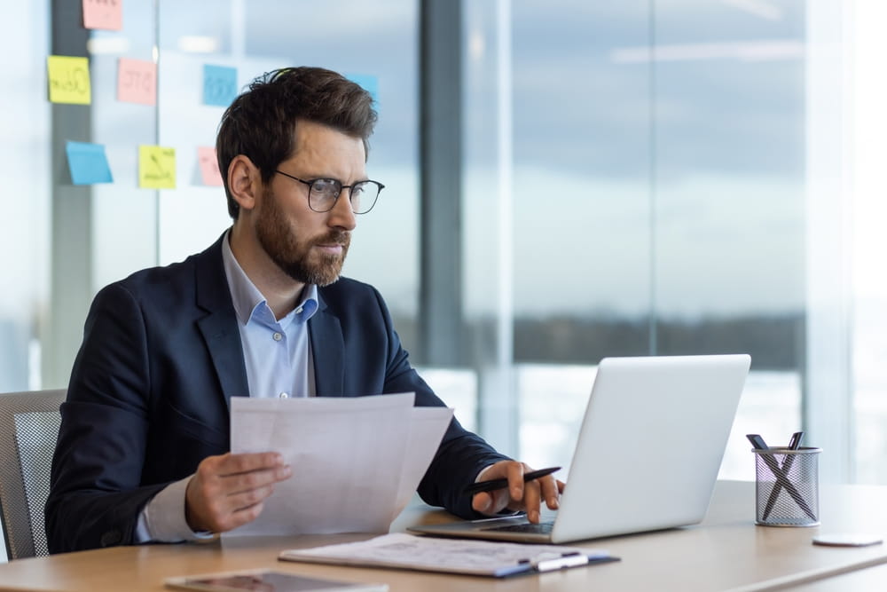 financier accountant doing paper work inside office
