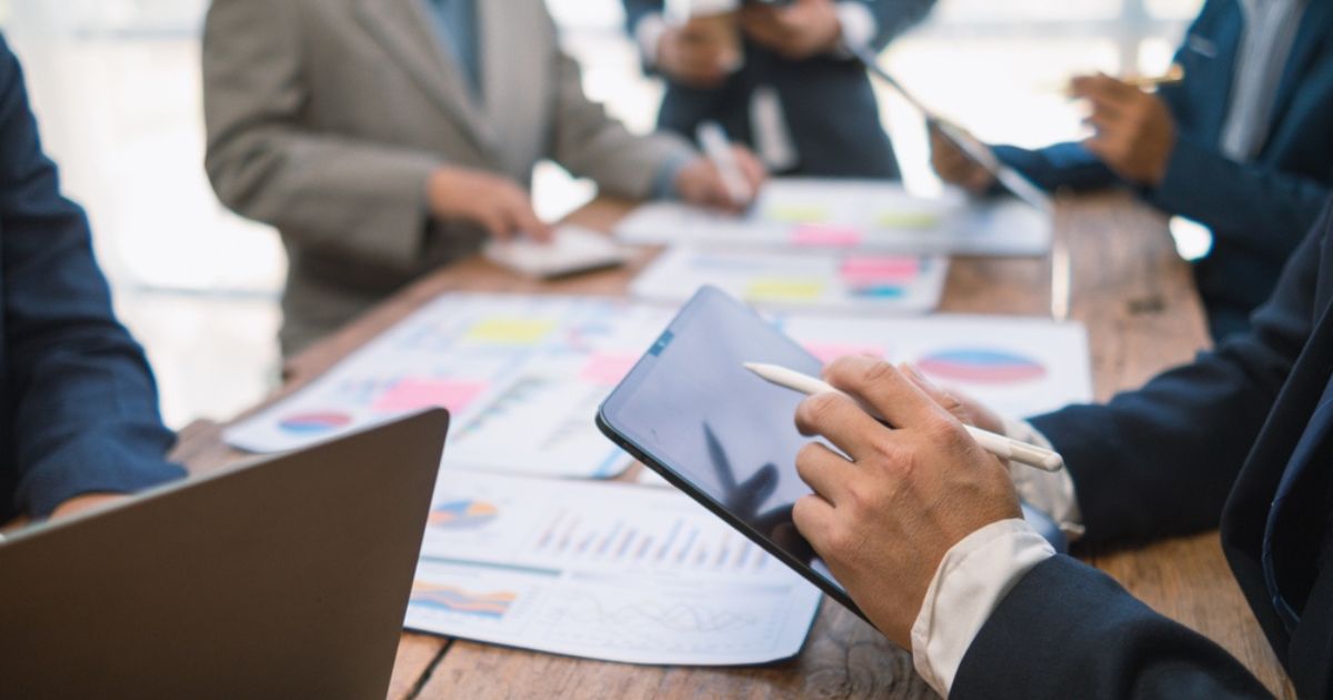 Business consultant attends committee meetings