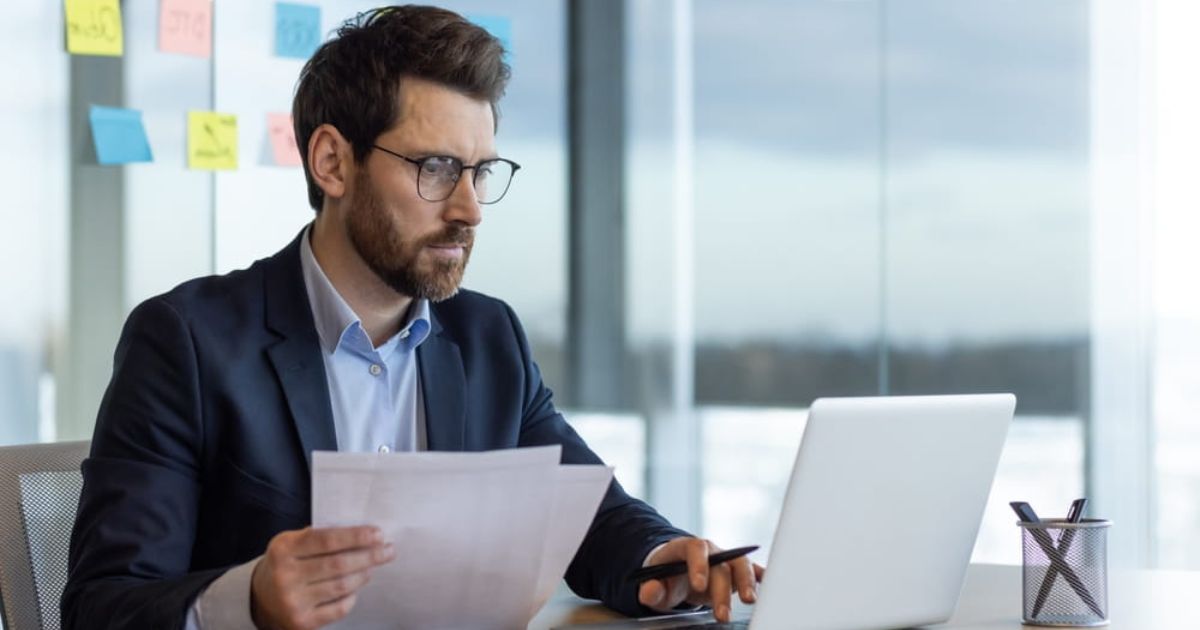 financier accountant doing paper work inside office