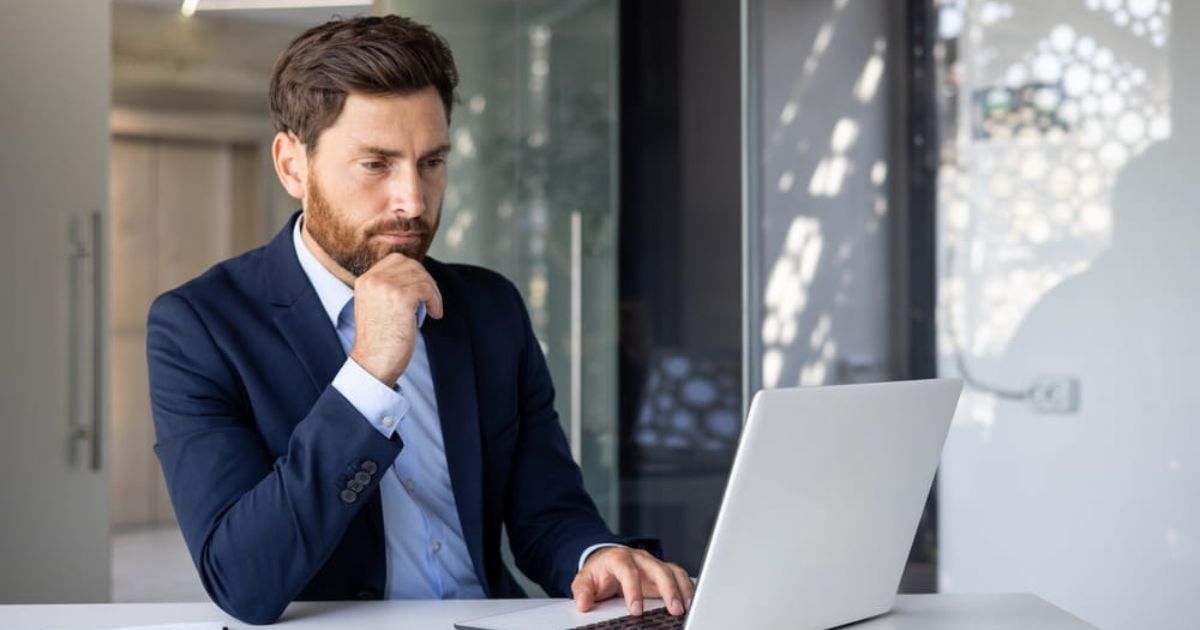 businessman at a desk on his laptop