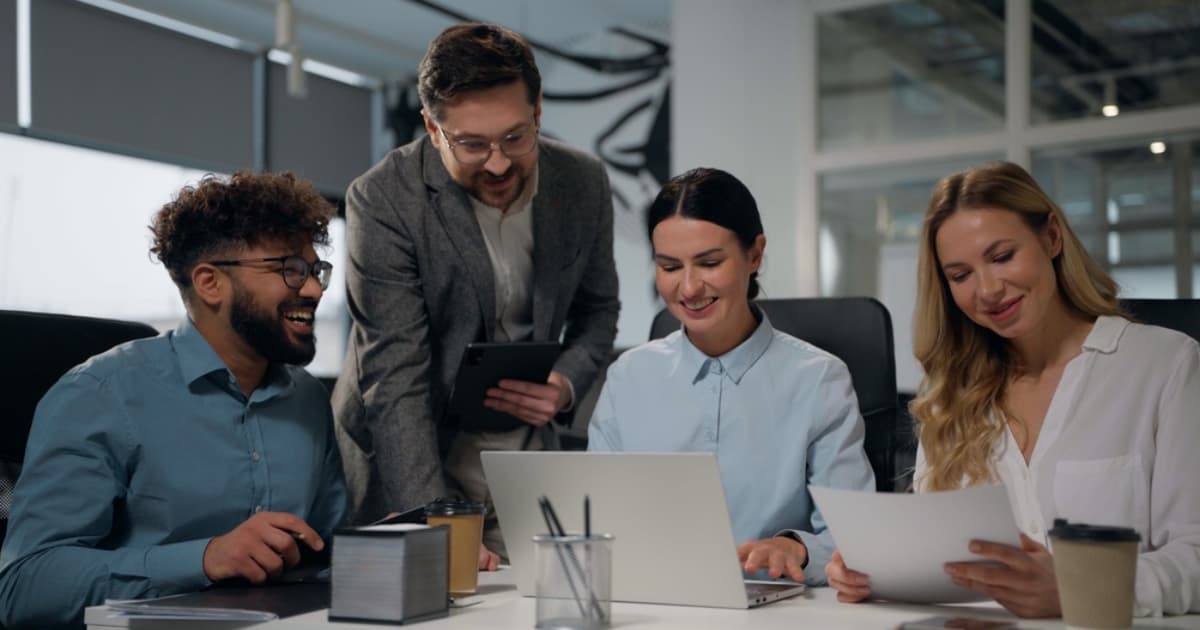 four laughing happy diversity business workers
