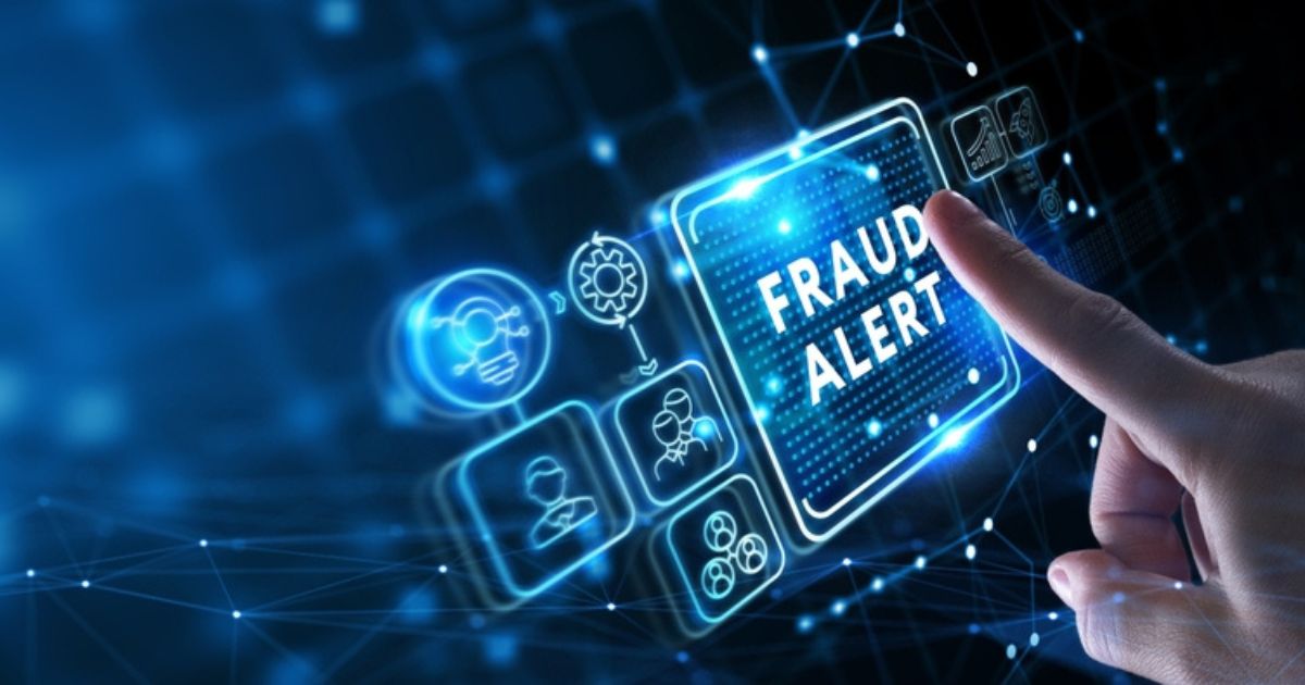 person clicking fraud alert button