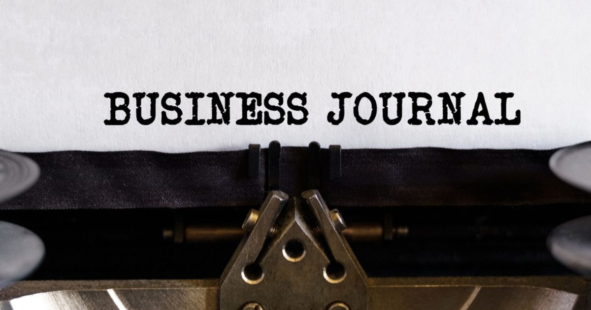 Vintage typewriter with typed text - BUSINESS JOURNAL