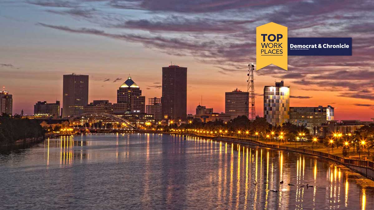 2022 Rochester's Top Workplaces award with skyline of city of Rochester at night