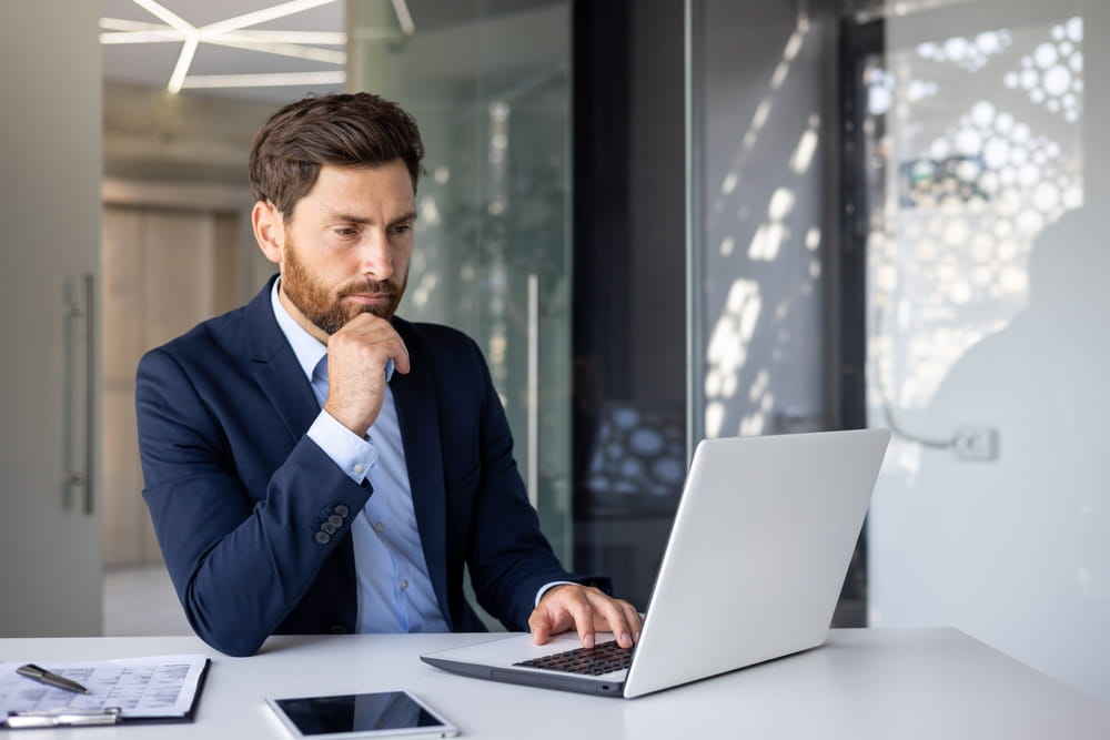 businessman at a desk on his laptop